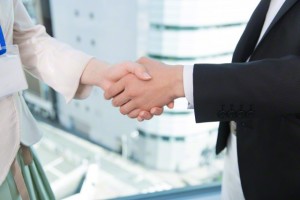 Business People Shaking Hands --- Image by © Top Photo Corporation/Corbis